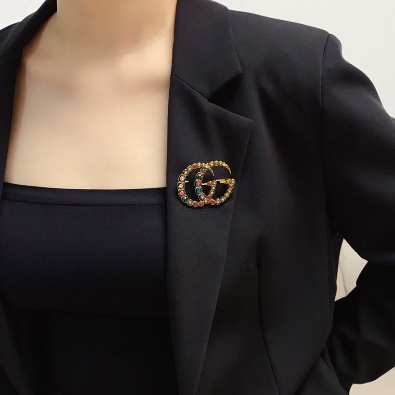 G*u*i brooches